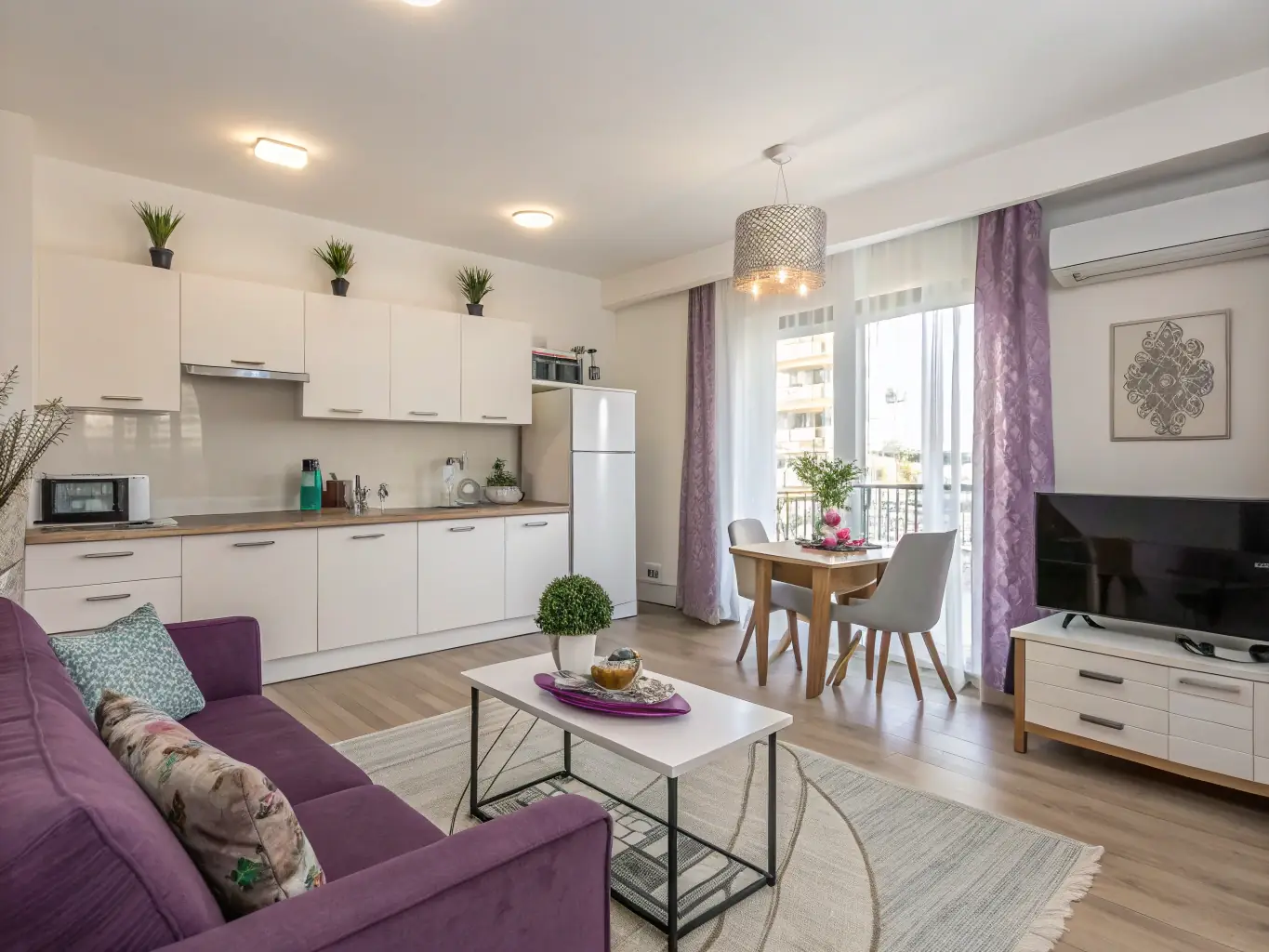 A photograph of a modern, stylish serviced apartment interior, highlighting the high standards of cleanliness and maintenance provided by Pulat Ltd.